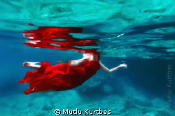 She is swimming in the sea with red dress and fresh water... by Mutlu Kurtbas 